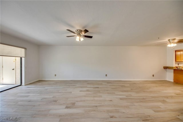 unfurnished living room featuring light wood-type flooring and ceiling fan