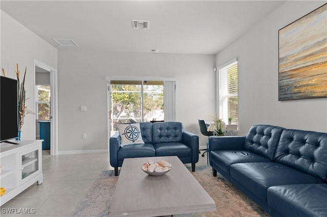 4320 Little Hickory Rd, Bonita Springs, FL 34134 - living room featuring a healthy amount of sunlight and light tile patterned flooring