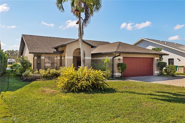 view of front facade featuring a garage and a front yard