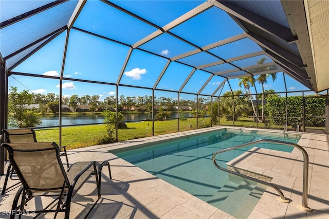 view of pool featuring a water view, a yard, a patio area, and glass enclosure