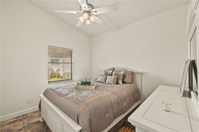 bedroom with vaulted ceiling and ceiling fan