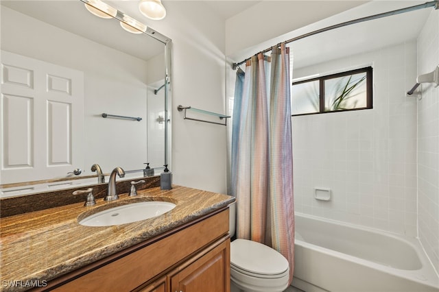 full bathroom featuring vanity, shower / tub combo, and toilet