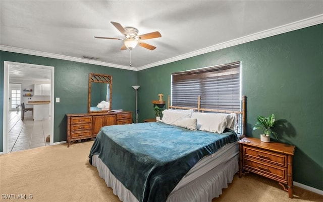 carpeted bedroom with crown molding and ceiling fan