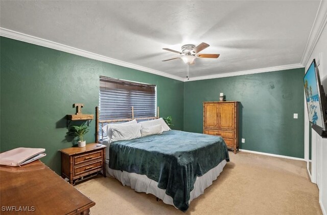 bedroom featuring light colored carpet, ornamental molding, and ceiling fan