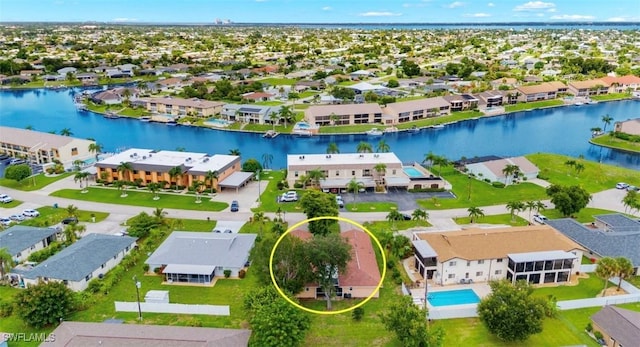 birds eye view of property with a water view