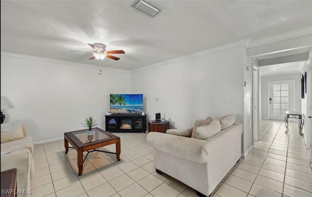 living room with ornamental molding, ceiling fan, and light tile patterned flooring