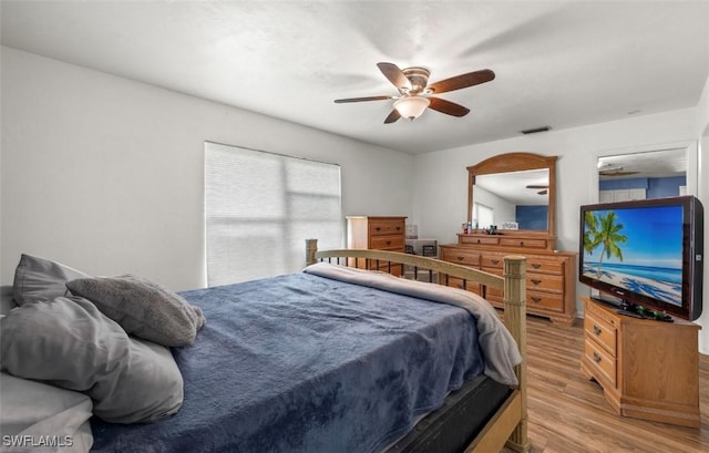 bedroom featuring ceiling fan and light hardwood / wood-style flooring