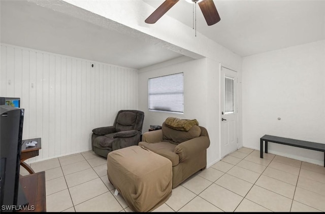 living room featuring light tile patterned floors and ceiling fan