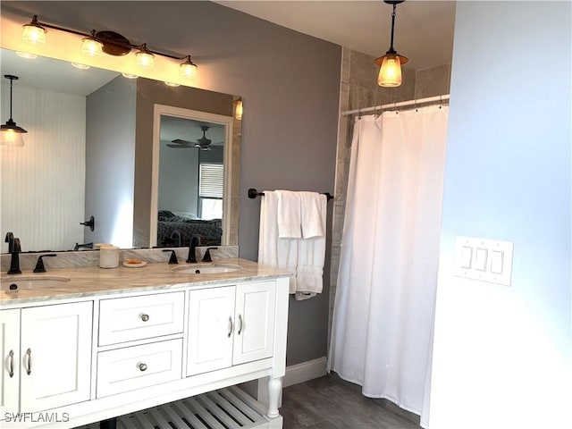 bathroom with vanity and hardwood / wood-style floors