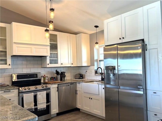 kitchen featuring pendant lighting, white cabinets, and appliances with stainless steel finishes