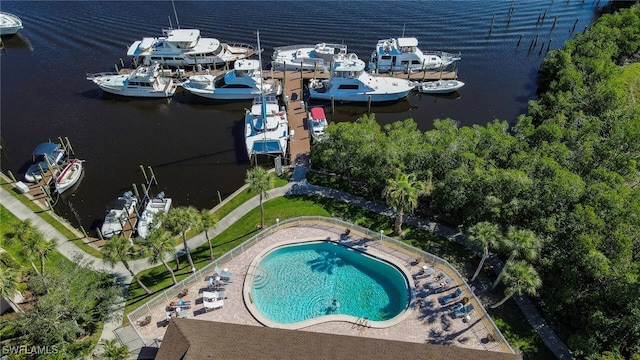 birds eye view of property with a water view