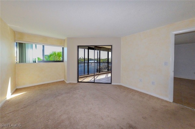 empty room with light colored carpet