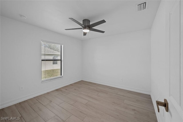 spare room featuring ceiling fan and light hardwood / wood-style flooring