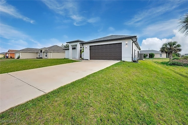 view of front of house featuring a garage and a front lawn