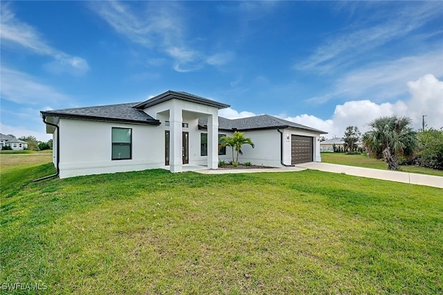 prairie-style home with a garage and a front lawn