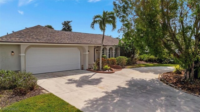 view of front of property with a garage