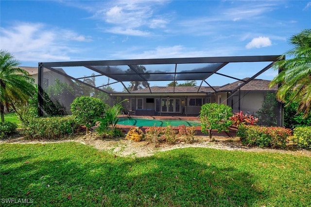 exterior space with a yard and a lanai