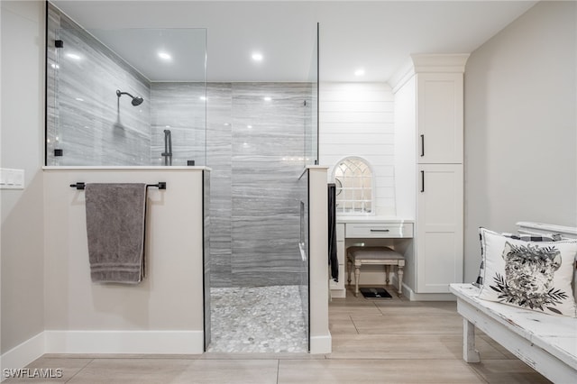 bathroom featuring tiled shower