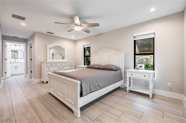 bedroom featuring sink and ceiling fan