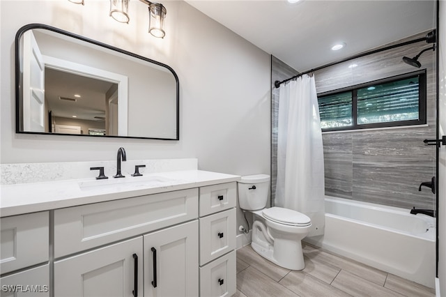 full bathroom featuring vanity, toilet, and shower / bath combo with shower curtain