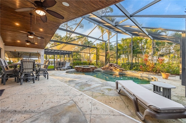 view of patio featuring a pool with hot tub, a lanai, and ceiling fan