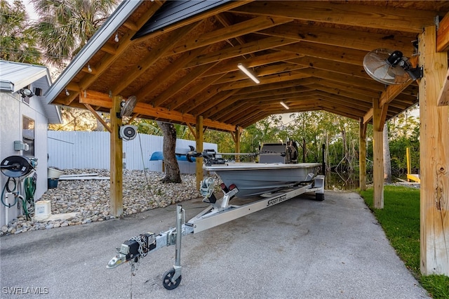 view of patio featuring fence and a detached carport