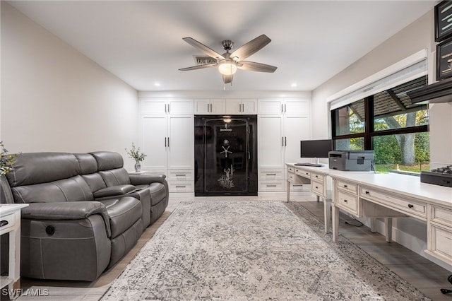 living room with a ceiling fan and recessed lighting