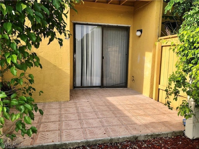 doorway to property with a patio