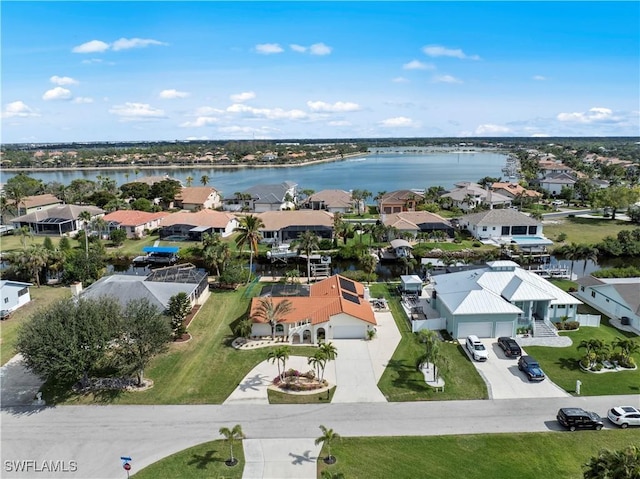 drone / aerial view with a water view