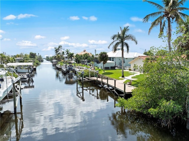 view of dock featuring a yard and a water view