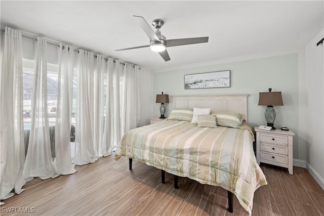 bedroom featuring ceiling fan and light wood-type flooring