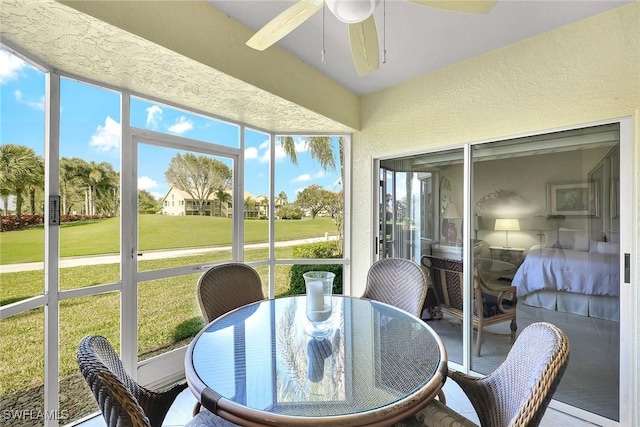 sunroom featuring ceiling fan and a wealth of natural light