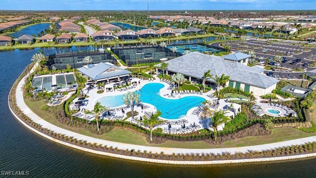 birds eye view of property featuring a water view