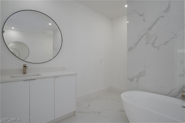 bathroom with a bathing tub and vanity