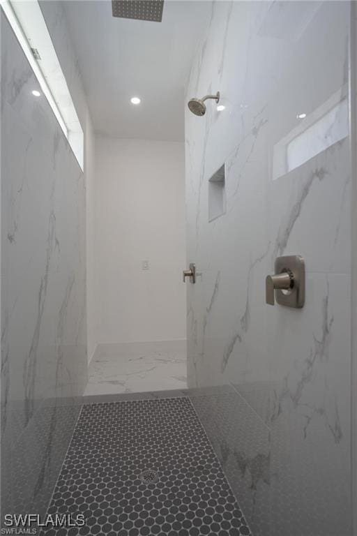 bathroom with tiled shower