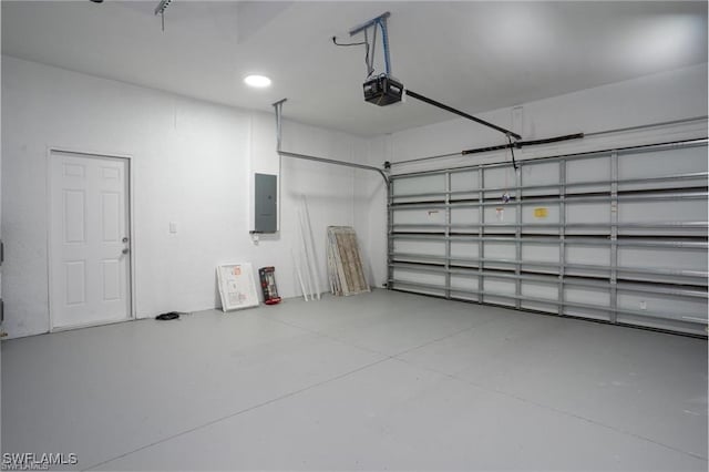 garage featuring a garage door opener and electric panel