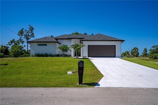 view of front facade featuring a garage and a front yard