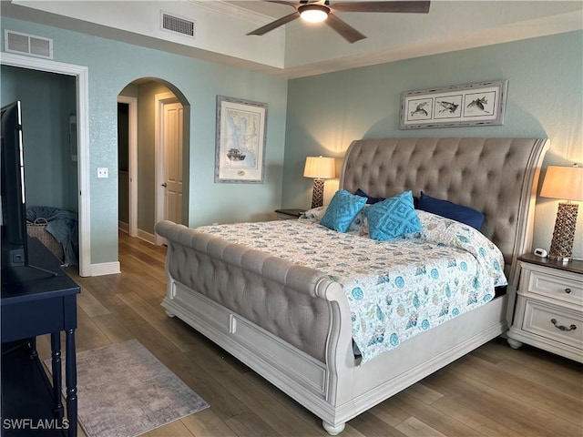 bedroom with ceiling fan and dark hardwood / wood-style flooring