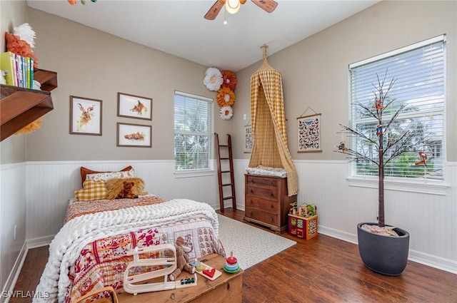 bedroom featuring ceiling fan and dark hardwood / wood-style floors