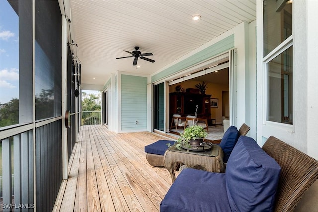 wooden deck with ceiling fan