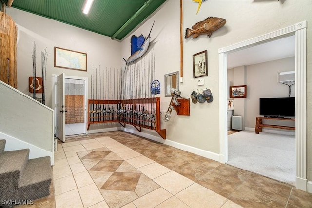 hall featuring light tile patterned flooring