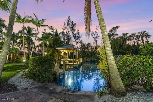 pool at dusk with a boat dock