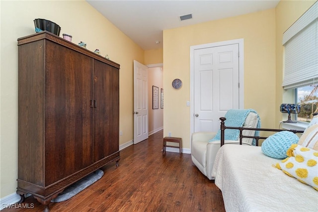 bedroom featuring dark hardwood / wood-style flooring