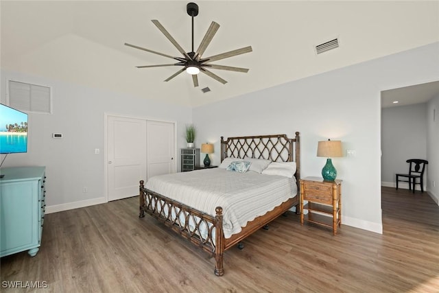 bedroom featuring hardwood / wood-style floors, a closet, and ceiling fan