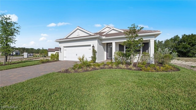 view of front of home featuring a garage and a front yard