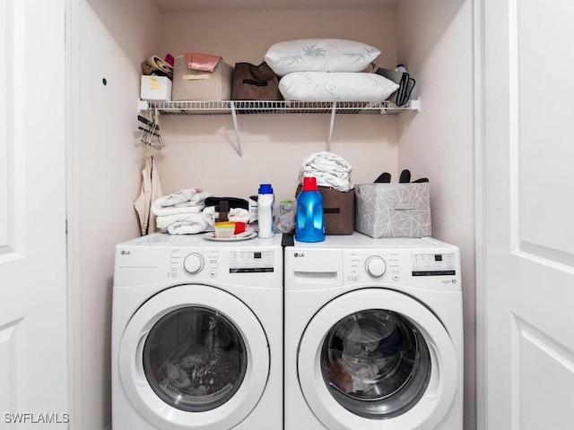 washroom with washer and dryer