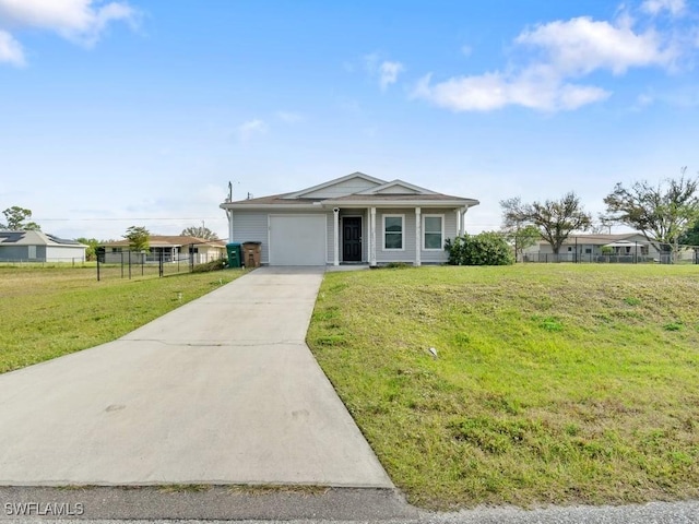 ranch-style house featuring a garage and a front yard