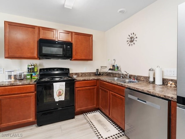 kitchen featuring sink and black appliances