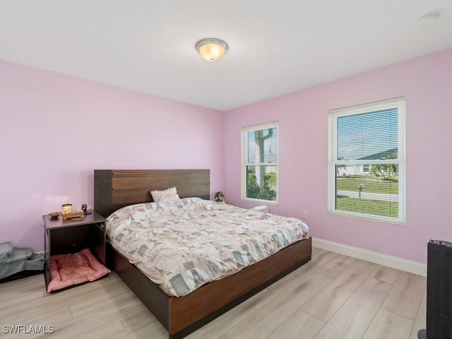 bedroom with light hardwood / wood-style flooring