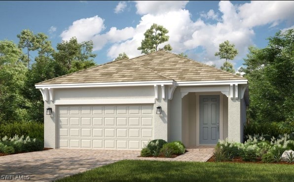 view of front of home with a garage, decorative driveway, and stucco siding